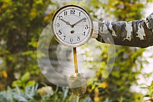 Dial with a pendulum from an old watch in the hands