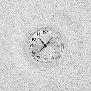 Dial of watch filled up by sand