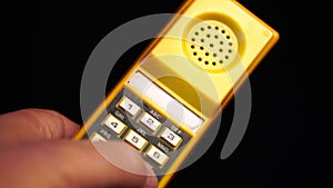 Dialing 911 on Vintage Speed Dial Telephone Device From 1980s, Close Up