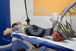 Diamagnetic Pump for Pain Therapy: Woman lying on a Bed Undergoing Therapy