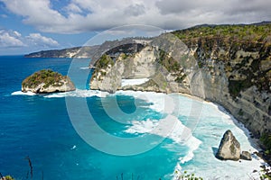 Diamond beach in Nusa Penida Island, Indonesia, surrouded by huge cliffs