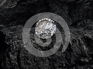 Diamond on black coal background