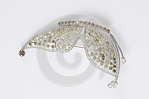 Diamond brooch in a butterfly shape on a white background