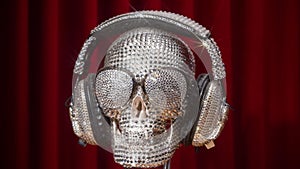 Diamond covered skull with headphones and sunglasses rotating