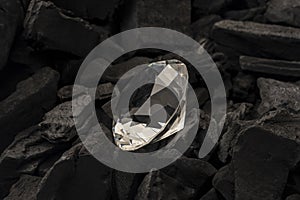 Diamond discovery in coal mine image concept for sparkling bright precious stones, climate change impact of mining diamonds, jewel