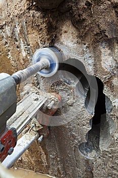 Diamond drilling holes in concrete wall