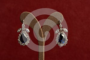 Diamond earrings with sapphires.