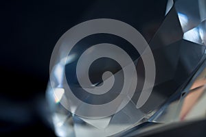 Diamond elements close-up on a black background. Abstraction. Defocused.