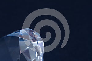 Diamond elements close-up on a black background. Abstraction. Defocused.