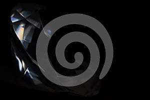 Diamond elements close-up on a black background. Abstraction. Defocused.