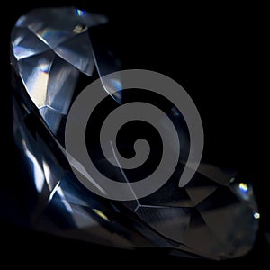 Diamond elements close-up on a black background. Abstraction. Defocused.