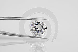 Diamond Held in Tweezers. Close Up View.