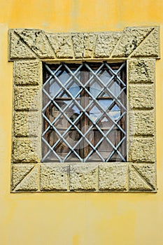 Diamond, iron barred window of, a 1700\'s building, in Italy