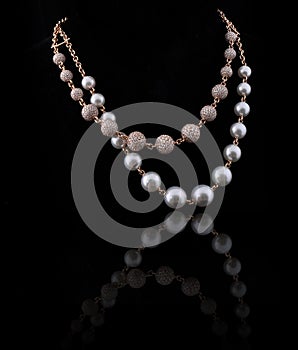 Diamond necklace with white and yellow pearl