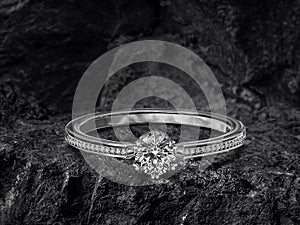 Diamond ring on black coal background