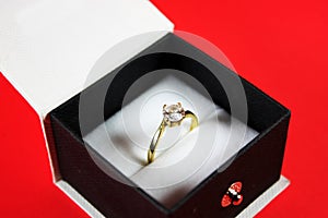 Diamond ring in a black jewelry box