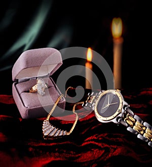 Diamond ring, gold watch, and necklace