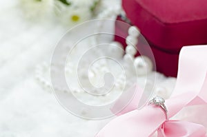 Diamond ring with pink ribbon