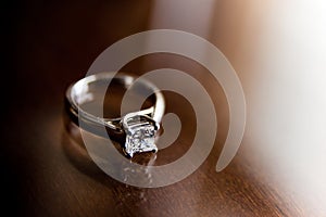 Diamond ring on wood table