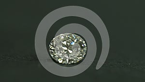 Diamond shine on the table black background. 1 carat diamond. jewelery diamond.