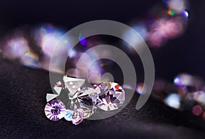 Diamond (small purple jewel) heap over black silk