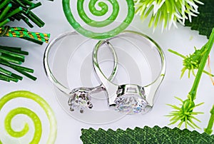 Diamond wedding rings on white background