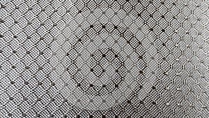 Diamond woven Black carbon fiber composite material background close up view