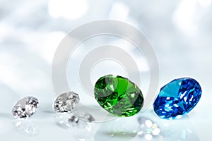 Diamonds, blue sapphire and green emerald brilliant cut jewels