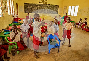 African children from the Maasai village in school uniforms in the classroom on a break