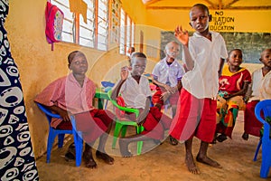 African children from the Maasai village in school uniforms in the classroom on a break