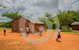 Kenya. African children in the maasai village playing soccer near the school