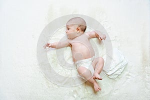 Diaper baby newborn child banner. Child care white background. Happy cute infant baby in nappy. Concept of childhood