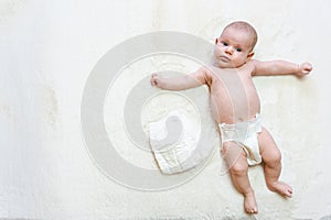 Diaper baby newborn child banner. Child care white background. Happy cute infant baby in nappy. Concept of childhood