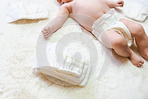 Diaper girl newborn baby banner. Child care white background. Happy cute infant baby in nappy. Newborn care, colic