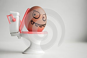 Diarrhea. Funny eggs with painted face concept