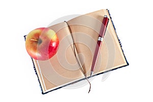 Diary with pen and apple