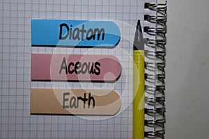 Diatom Aceous Earth write on sticky note isolated on Office Desk