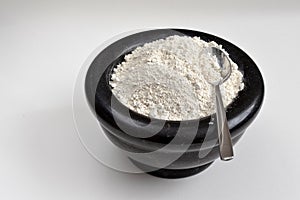 Diatomaceous Earth in bowl with spoon