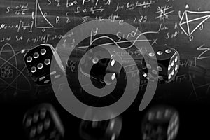 dice on the background of formulas.