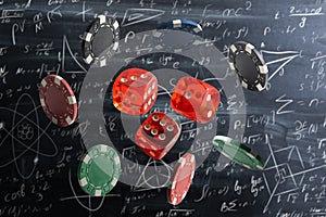dice on the background of formulas.