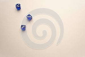 three dices blue color on light background