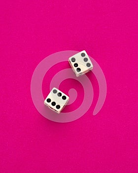 Dice for board game on rhodamine red background - Entertainment in casino