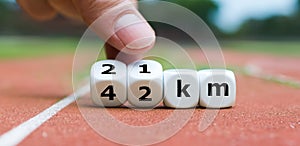 Dice form the expression '21 km' and '42 km'. photo