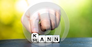 Dice form the German expression `Mann kann` man can.