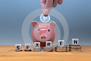 Dice form the German word `sparen` `save money` in English photo