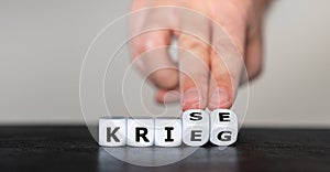 Dice form the German words `Krieg` war and `Krise` crisis.