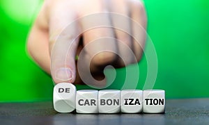 Dice form the word decarbonization. Symbol to reduce carbon dioxide