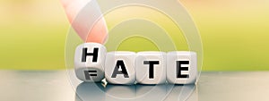 Dice form the words `hate` and `fate`.