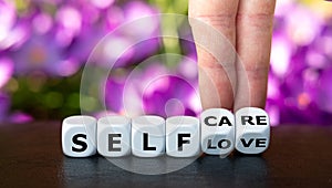 Dice forms the expressions `self love` and `self care`. photo