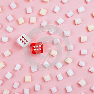 Dice with hearts and rows of marshmellow